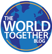 The World Together Blog logo, which is the title superimposed on a globe with a thin line outlining the globe.