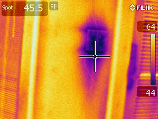 Thermal Imaging of a wall outlet reveal a cold spot reaching 44 degrees (F), while areas around are up to 64 (F).