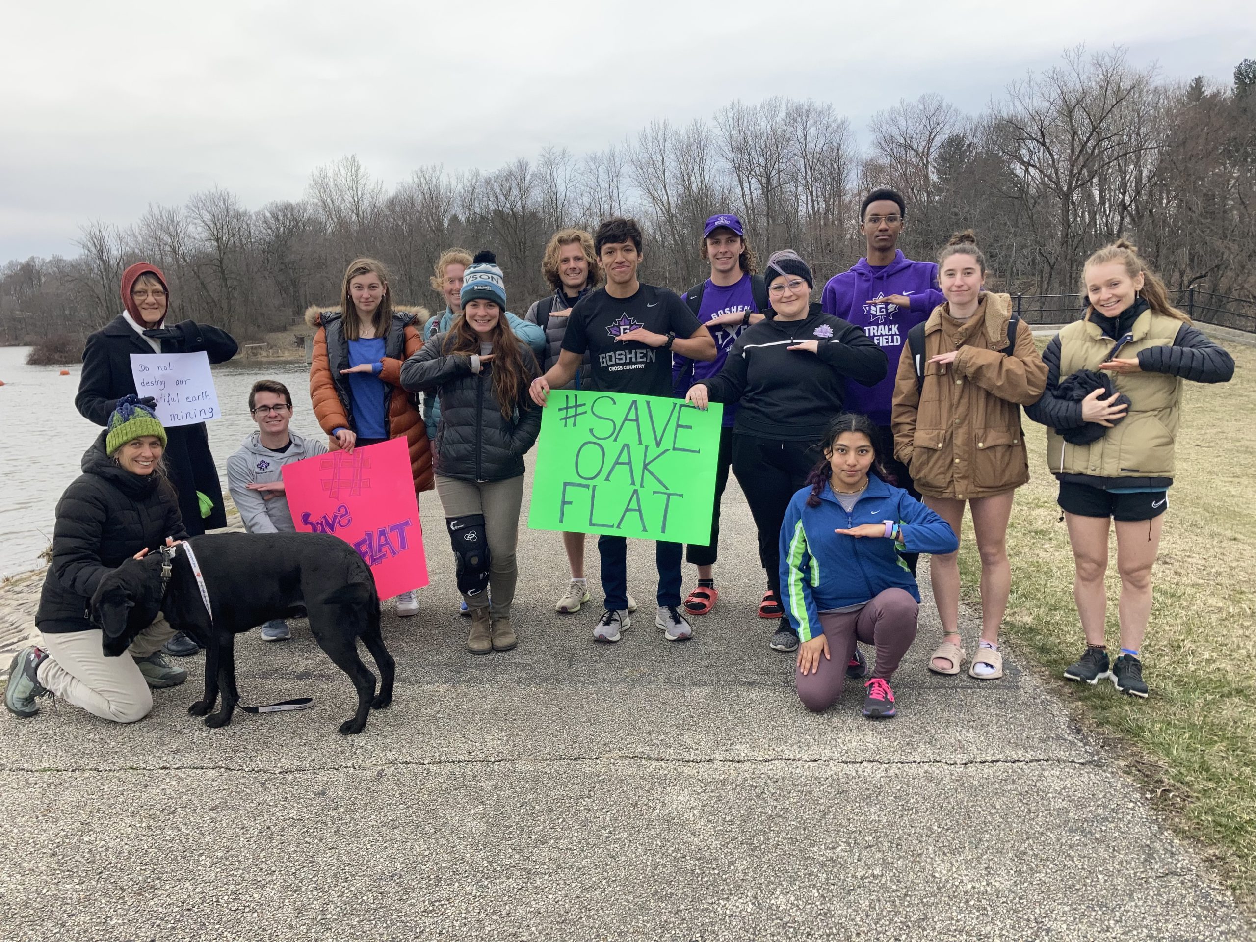 Students and community members in Goshen, Indiana walked to the Elkhart River on Tuesday where Manny Villanueva, (center with the green sign), led the group in prayer for Oak Flat and the Apache stronghold. Photo contributed by Arleth Martinez.