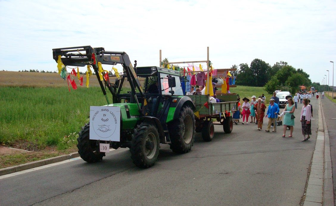 In 2009, the year “Hand in Hand” opened, members of the Mennonite Church of Enkenbach marched in the village parade wearing clothes donated to the shop. Photo contributed by Dora Schmidt.